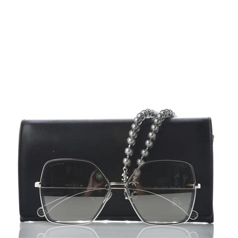 chanel glasses with pearl chain.